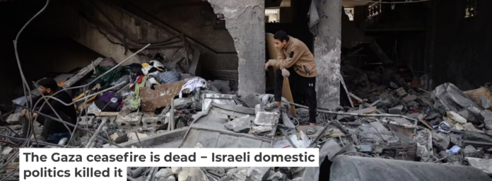 Buildings and a ceasefire left in ruins after airstrikes on March 18, 2025. Majdi Fathi/NurPhoto via Getty Images